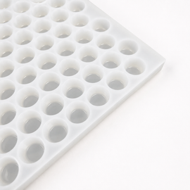 Close-up of an empty 3mL gumdrop gummy mold with 262 cavities on a white background