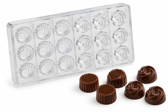Polycarbonate chocolate mold with 18 cavities, including 9 fluted muffin cup cavities and 9 swirl cavities, with finished chocolates